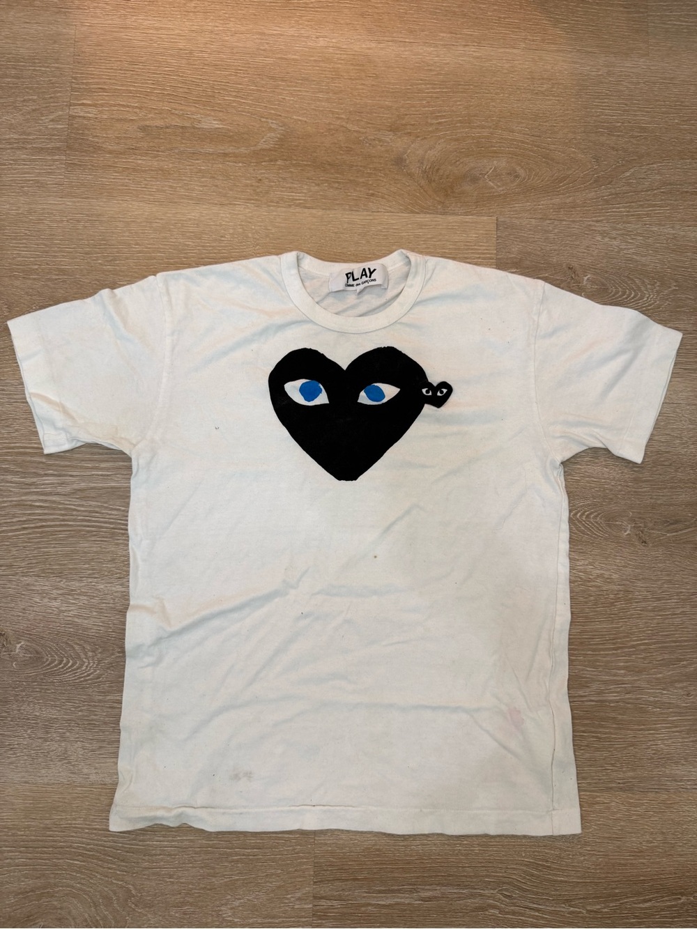 Comme des Garcons White Tee with Black Heart and Blue Eyes